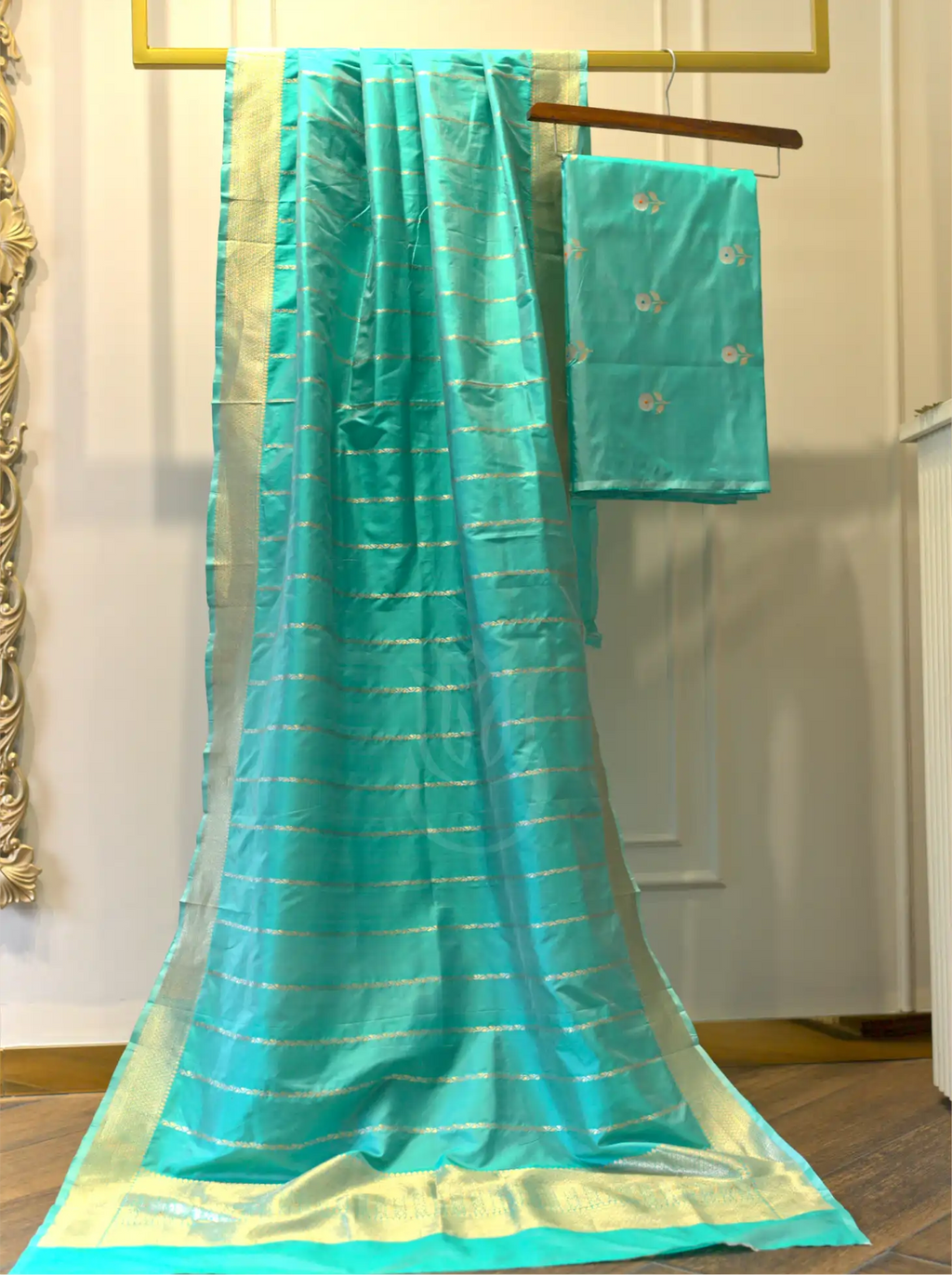 Macro close-up view of sea green handwoven Banarasi silk suit fabric highlighting the intricate weave, subtle sheen, and fine zari thread details