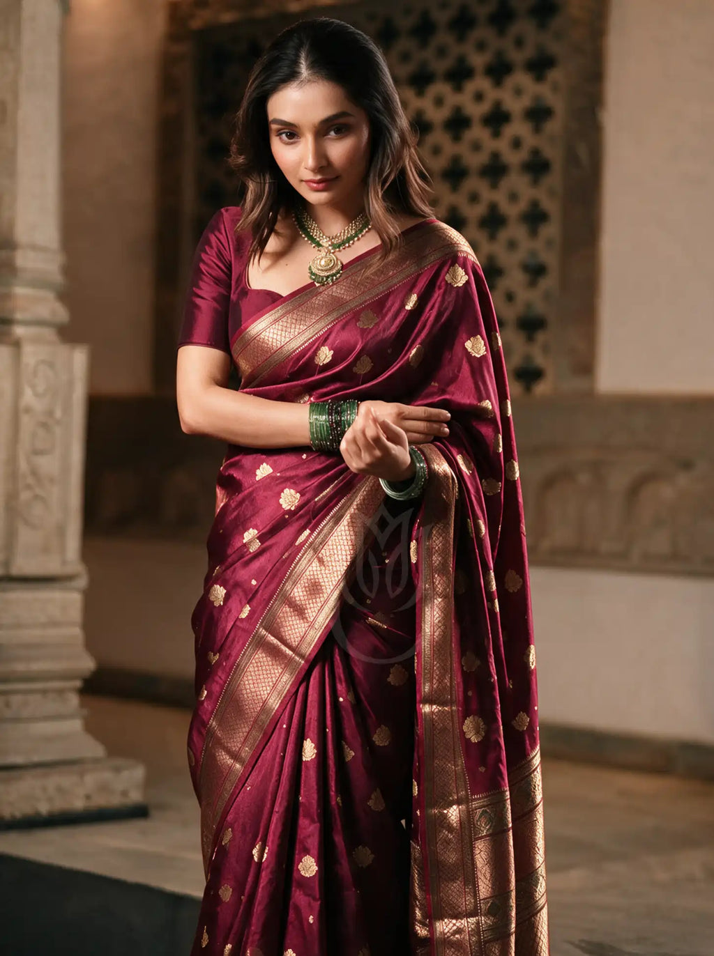A handwoven pure silk saree combining Kanjivaram and Paithani traditions, featuring a rich silk drape with intricate gold zari borders and a detailed decorative pallu folded over the shoulder.