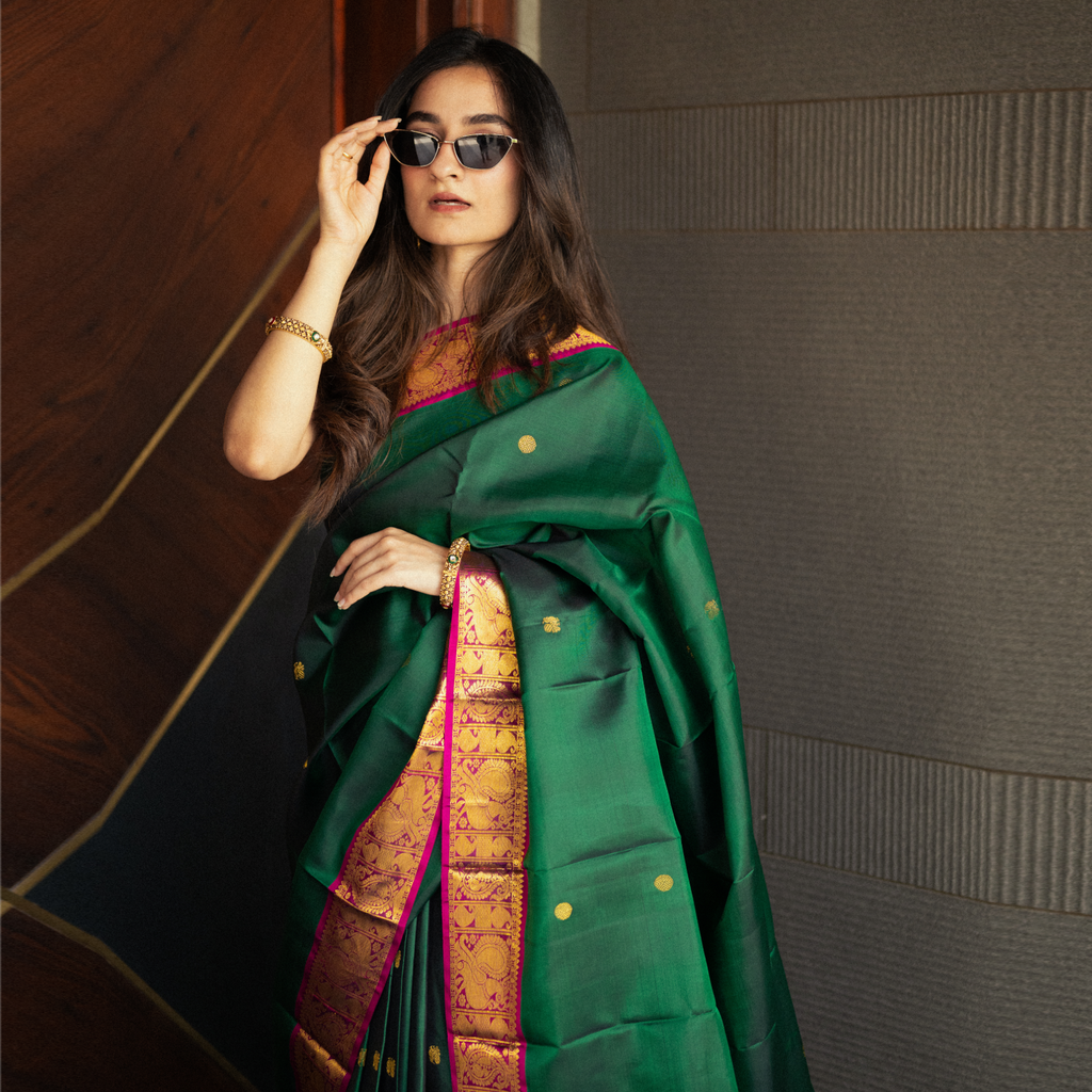 Handwoven Kanjivaram silk saree with contrast purple border and gold zari pallu for wedding wear