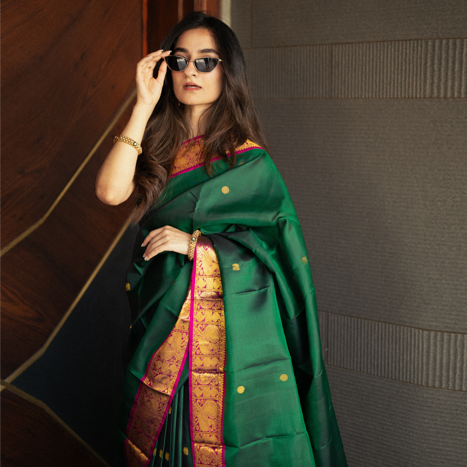Handwoven Kanjivaram silk saree with contrast purple border and gold zari pallu for wedding wear