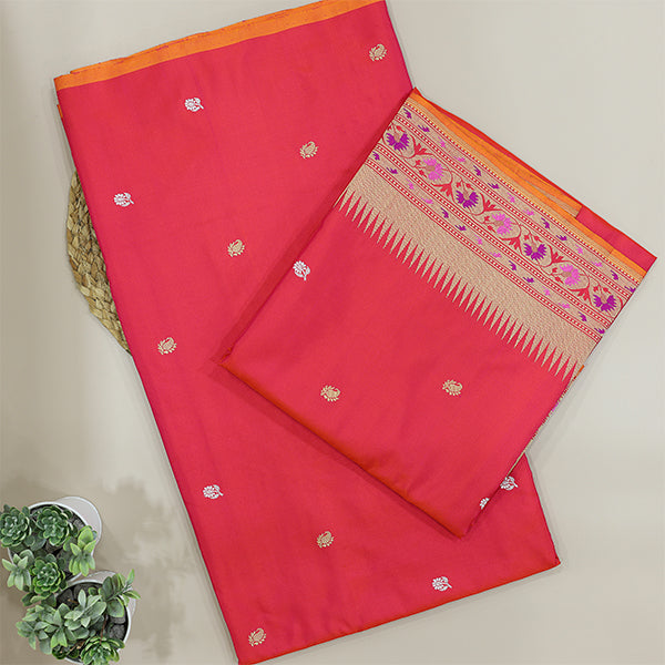 Close-up shot of the premium fiery ember handwoven Katan silk fabric texture highlighting the authentic handloom weave.