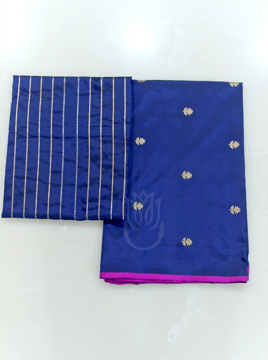 Royal blue handwoven Kora Katan silk unstitched suit fabric with silver zari floral bootis, magenta border, and matching gold striped dupatta.
