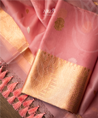 Handwoven Kora silk suit with rich zari weaving, lightweight premium festive wear for weddings and special occasions