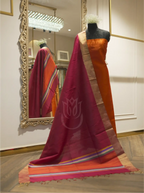 Handwoven Matka silk orange suit displayed on a mannequin, styled with a draped magenta dupatta featuring gold tissue borders and a multi-color striped palla