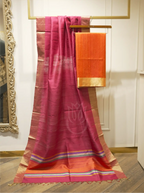Handwoven Matka silk orange suit fabric draped alongside a deep magenta dupatta with gold tissue borders and multi-color striped palla on a wooden hanger stand