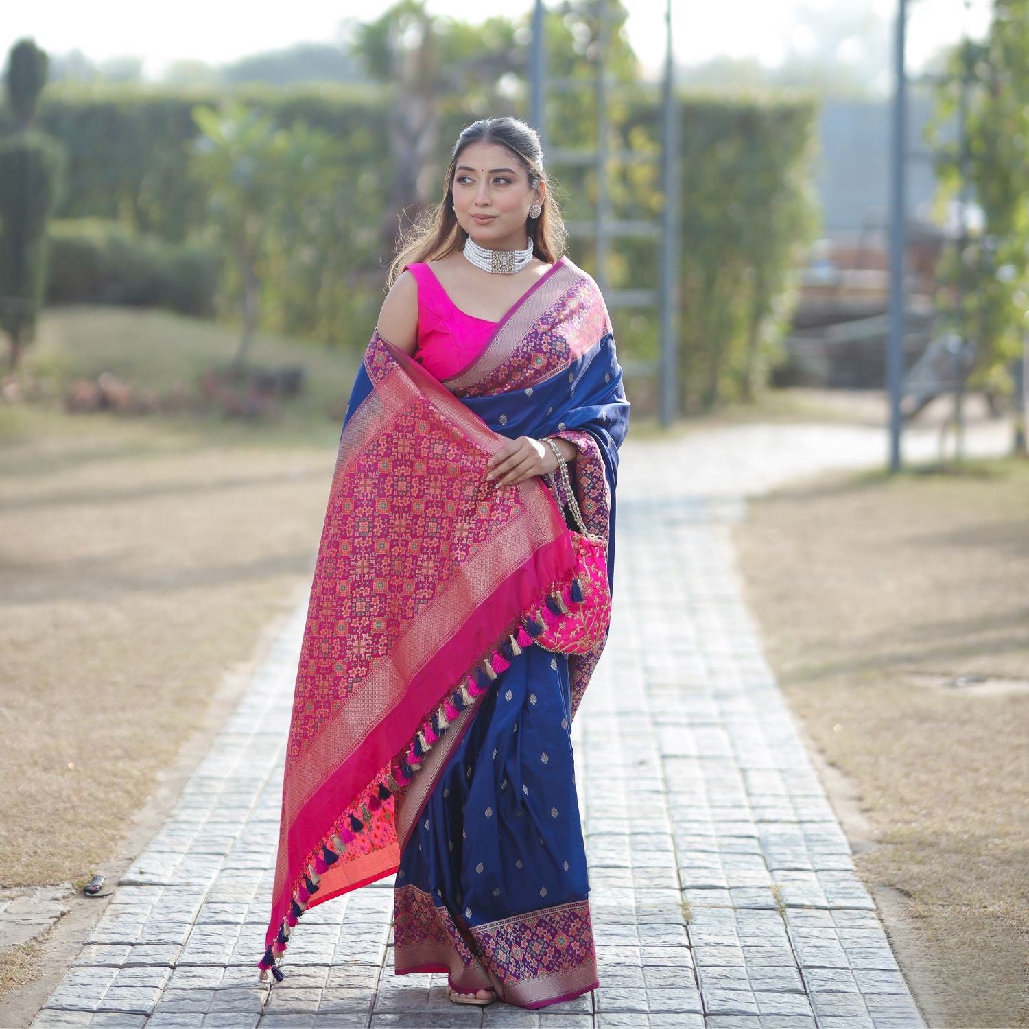Handwoven pure Patola silk saree in royal blue and pink with traditional woven design