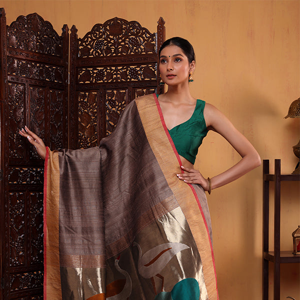 Detailed close-up of the premium Coffee Elegance handwoven pure silk fabric highlighting the luxury texture and traditional Uchan Palla weave.