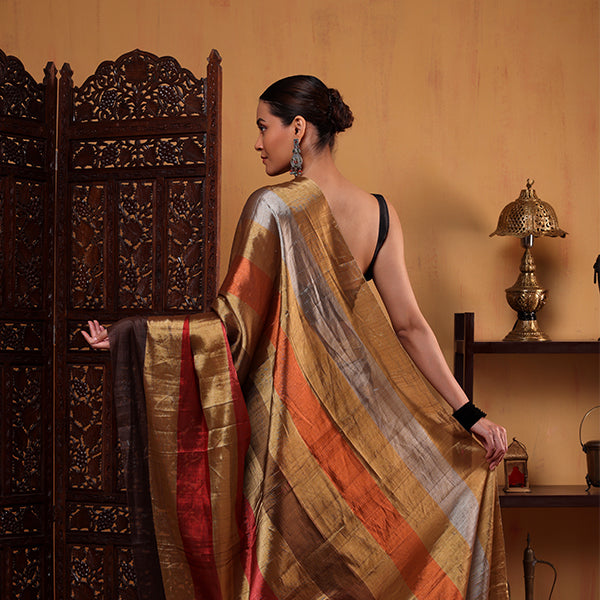 Close-up shot of the beautiful handcrafted tassels adorning the edge of the Terra Tapestry multicoloured tissue saree.