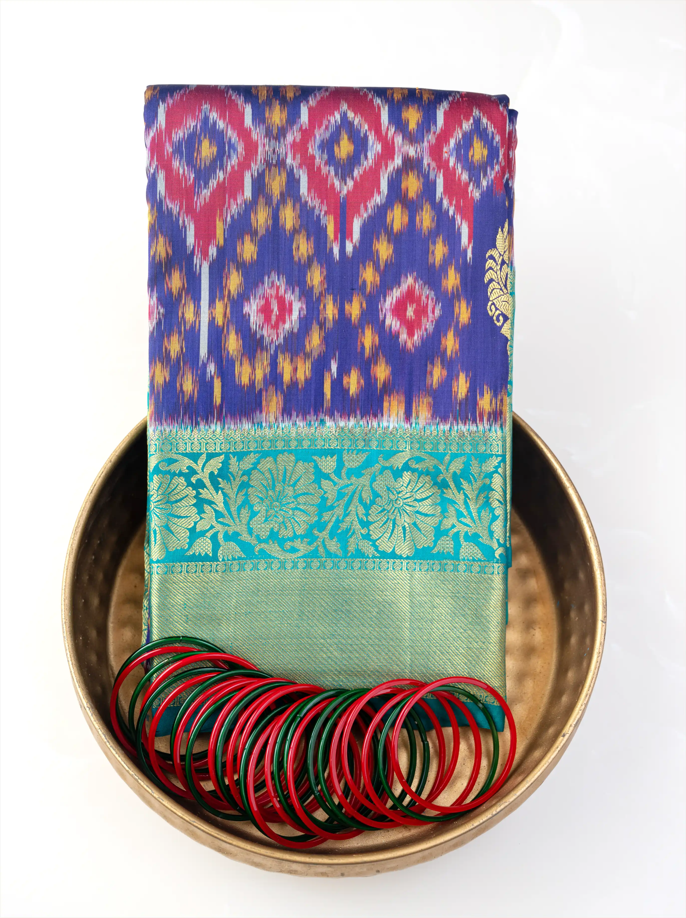 Close-up view of the pallu and border on a handwoven purple and green Patola Kanjivaram silk saree.