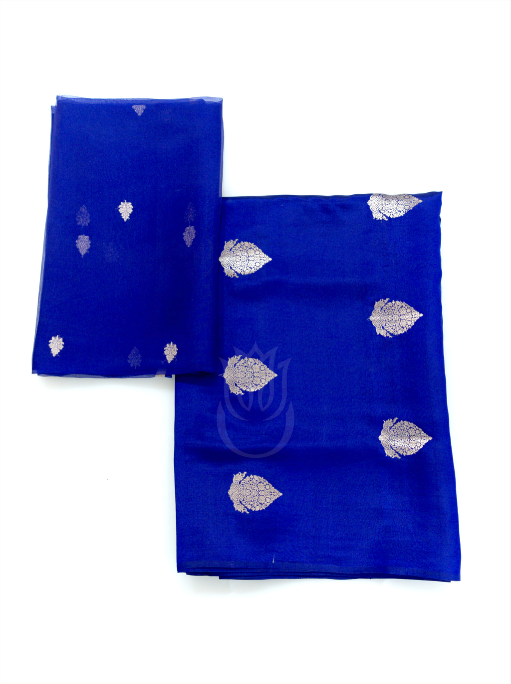 Folded royal blue handwoven silk suit fabric featuring silver zari kalga bootis paired with a matching folded sheer dupatta displaying small floral motifs on a plain white background