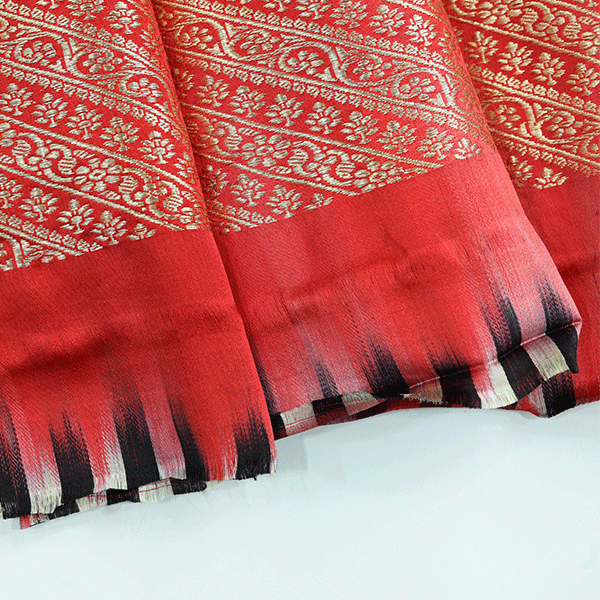 Flat lay of the unstitched premium gold full Zari Jaal blouse fabric included with the Crimson Majesty Satin Saree.