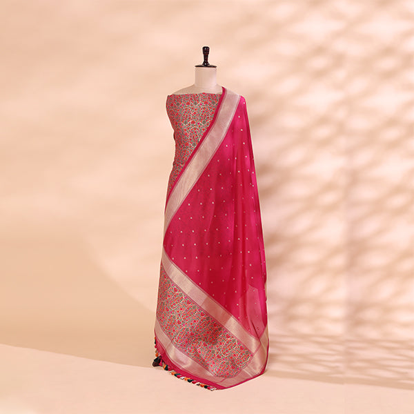 An unstitched imperial plum handwoven Khin Khwab silk suit displayed on a mannequin, featuring a draped luminous cream-spectrum dupatta with intricate gold Zari borders.