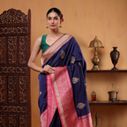 Detailed view of the vibrant pink and gold Zari woven contrast pallu on the Indigo Enigma Banarasi silk saree.