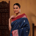Detailed view of the unstitched pink silk blouse fabric with its matching tri-color weave border design.
