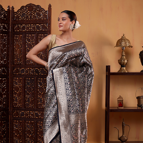 Detailed display of the opulent, heavy gold Zari woven pallu featured on the Indigo Majesty Katan silk saree