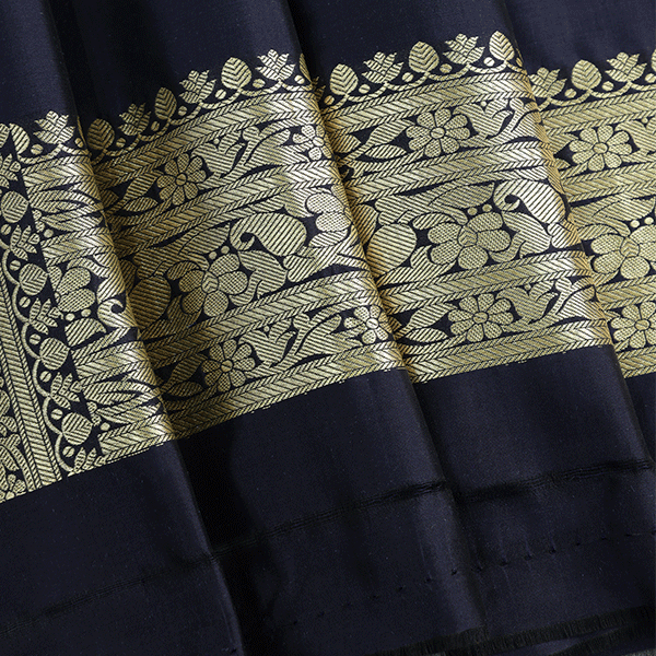 Full length view of the Indigo Golden Shikargah Majesty silk saree alongside its matching unstitched pure silk blouse piece with border.