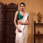 Close-up shot highlighting the premium natural texture, authentic weave, and white satin border of the handwoven pure Munga silk saree.