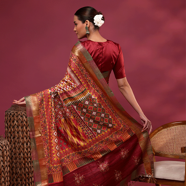 Detailed view of the striped unstitched blouse material with a Kantha embroidery border included with the Tussar silk saree.