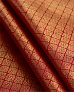 Stylized shot of the Kanjivaram silk saree, ideal for bridal or festive occasions.