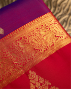 Close-up of the premium handwoven Kanjivaram silk fabric texture and zari weave.