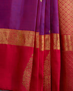 Close-up shot of the intricate gold zari pallu on the handwoven Kanjivaram silk saree.