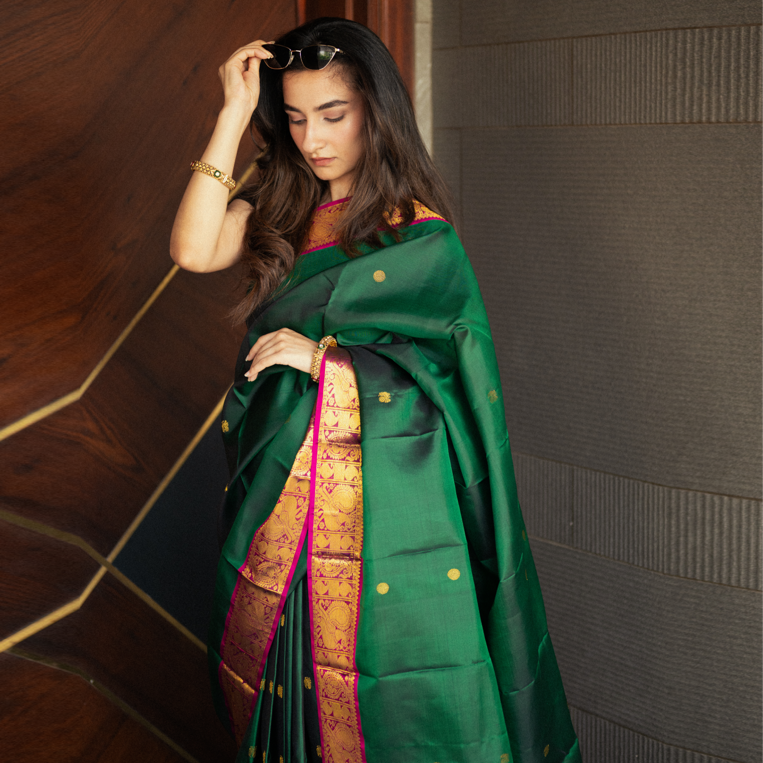 Kanjivaram silk saree with rich gold zari border and heavy pallu for bridal occasions