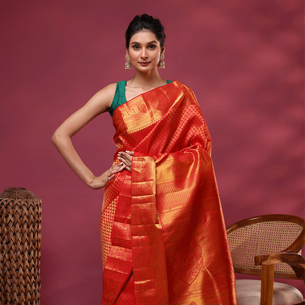 Detailed view of the matching unstitched Kanjivaram silk blouse material featuring a handwoven Self Jaal pattern with a rich golden zari border.