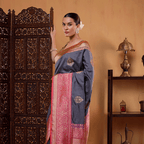 Close-up shot of the authentic Banaras handloom pure katan silk fabric highlighting the intricate traditional gold and silver sauna rupa bootas.