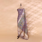 Side view of the unstitched lavender pure Banarasi silk dress material and draped digital Kalamkari dupatta on a mannequin.