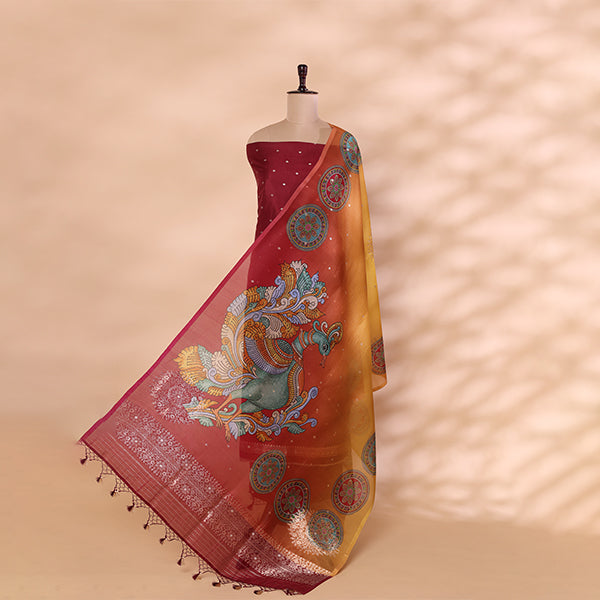 Vibrant magenta handwoven Banarasi silk unstitched suit paired with a multicolored Kalamkari organza dupatta featuring traditional floral and peacock motifs, displayed on a mannequin.
