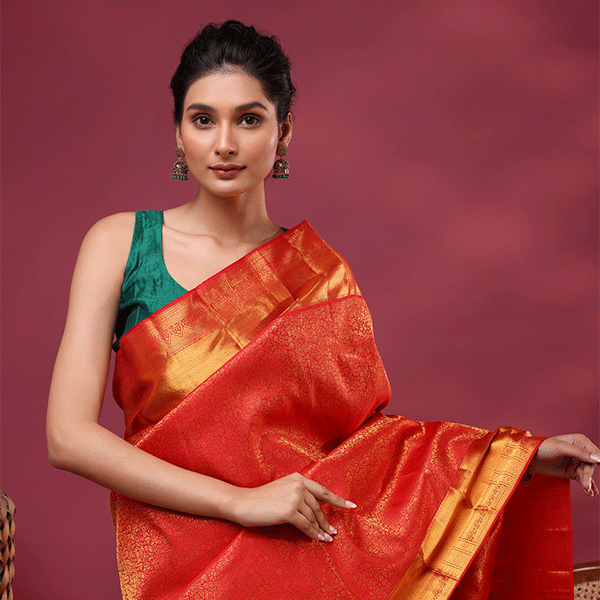 Unstitched one-meter pure Kanjivaram silk blouse fabric in vibrant pink magenta, featuring a handwoven self jaal pattern with a gold border.