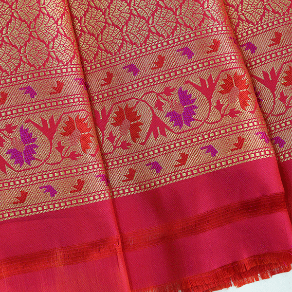Full-length studio shot of the elegant Majestic Magenta silk saree, showing a regal drape perfect for weddings, pujas, and festive celebrations.