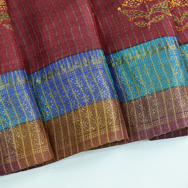 Full-length studio shot of the handwoven maroon Kantha Tussar silk saree, styled elegantly for festive and wedding occasions.