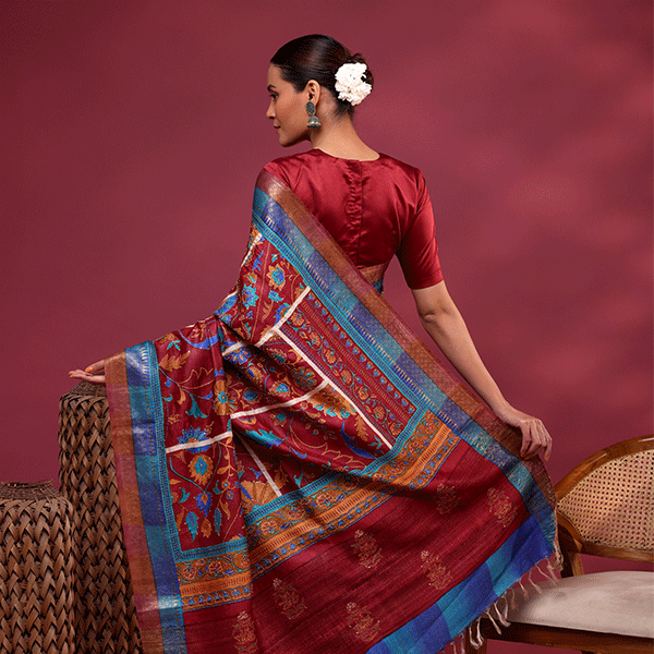 Detailed drape view of the Maroon Enchantment Tussar silk saree, highlighting the clean drape of the pleats and the contrasting border texture.