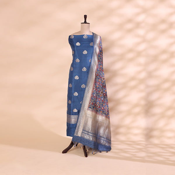 Deep azure handwoven Banarasi Patola Silk suit paired with a vibrant, multicolored traditional tapestry dupatta displayed on a mannequin