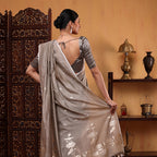 Close-up view showcasing the intricate traditional Kalanga Aanchal design on the serene grey Banarasi cotton saree.