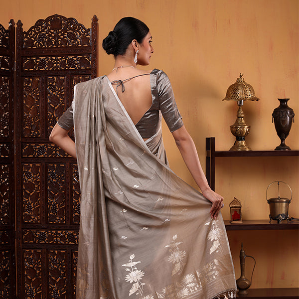 Close-up view showcasing the intricate traditional Kalanga Aanchal design on the serene grey Banarasi cotton saree.