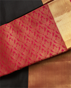 A woman wearing a premium Kanjivaram border silk saree, perfect for bridal and festive occasions.