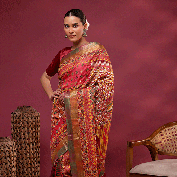 Close-up shot showing the intricate multicolored hand-woven Kantha embroidery work on the pure Tussar silk saree pallu.