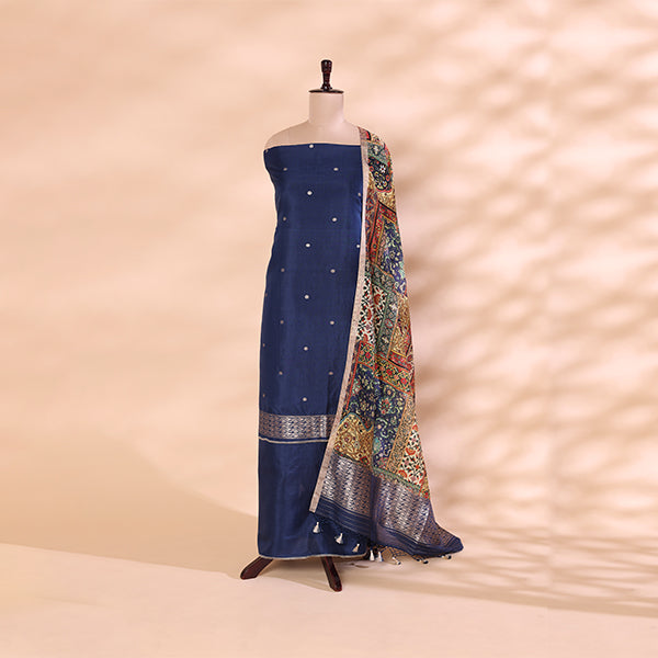 A mannequin displaying a navy blue and multicoloured Banarasi Khadua silk unstitched suit paired with a detailed traditional Pichwai dupatta.