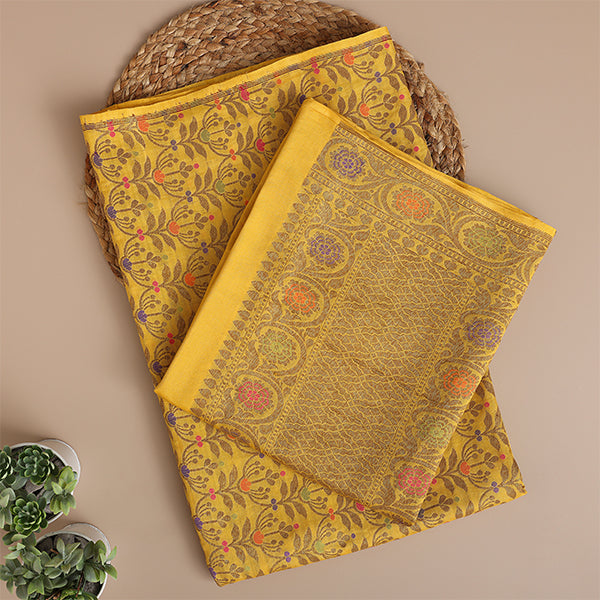 Close-up shot of the intricate traditional Zari and Resham embroidery work on the golden yellow handloom Munga Silk fabric.