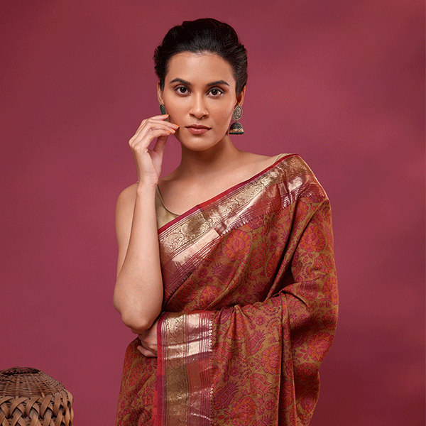 A woman posing in the Mystic Elysium Saree crafted from pure China silk with twilight purple and moonlit gold digital prints.