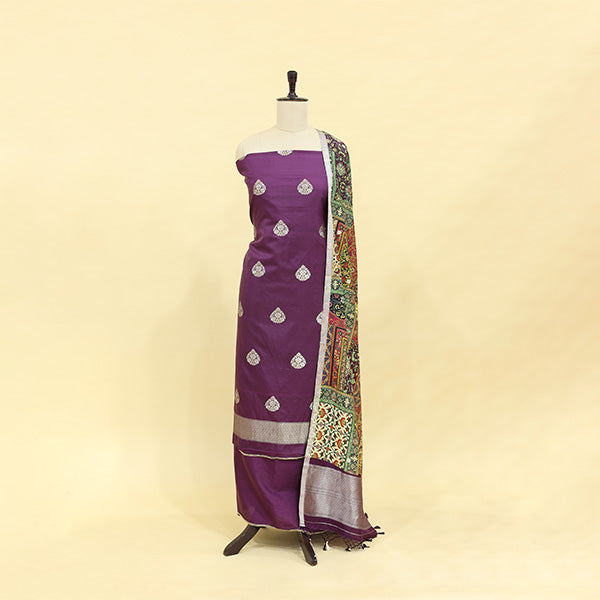 Amethyst purple Banarasi Khadua silk unstitched suit displayed on a mannequin with a multicoloured handcrafted Pichwai dupatta.