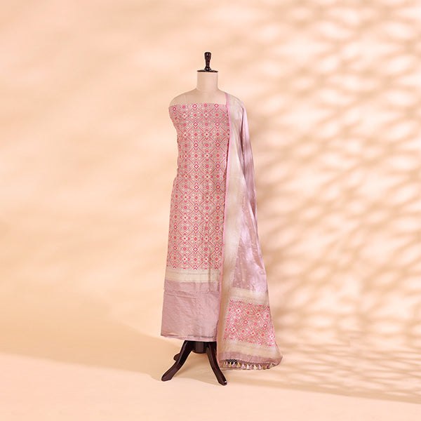 Unstitched deep mystic twilight Patola silk suit paired with a vibrant, prismatic multicoloured handwoven dupatta.
