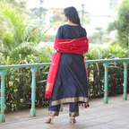 Back view of a Navy Blue Handwoven Banarasi Silk Suit showing the clean silk finish, red Kora silk dupatta, and matching trousers with gold zari borders.