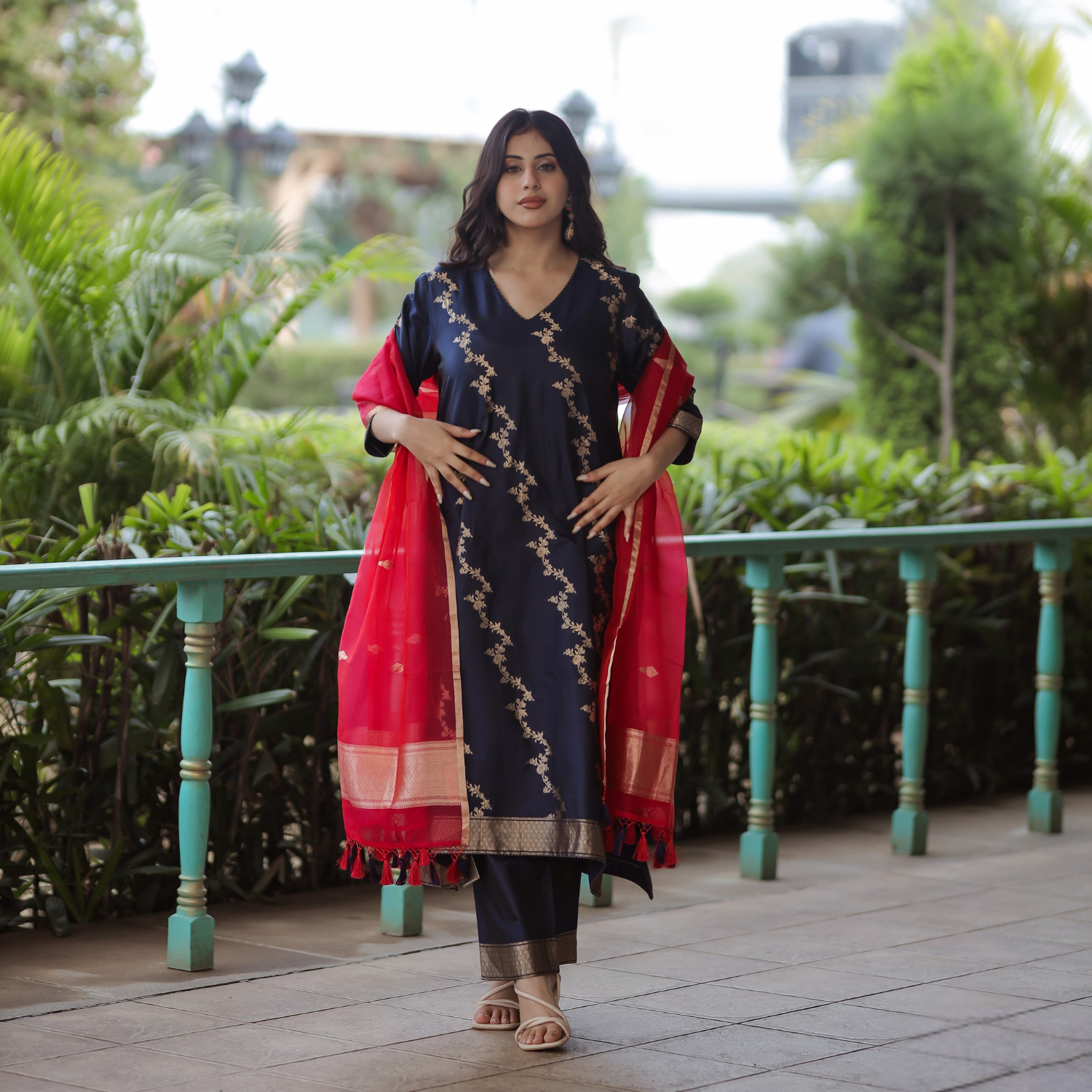Full-length view of a Navy Blue Handwoven Banarasi Silk Suit with a contrast Red Kora Silk Dupatta and 3/4 sleeves.