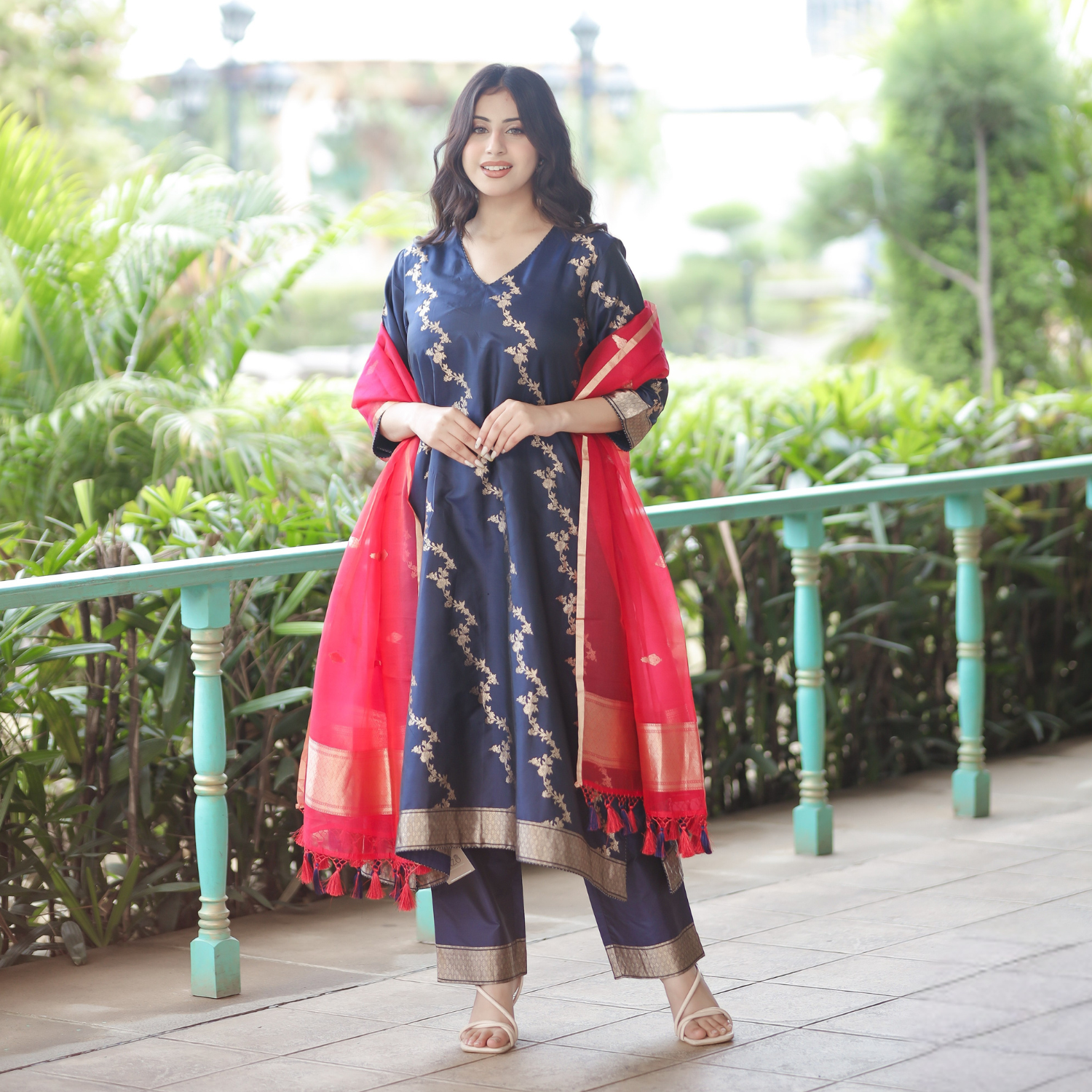Full-length view of a Navy Blue Handwoven Banarasi Silk Suit featuring gold zari work, 3/4 sleeves, and a contrast Red Kora Silk Dupatta.