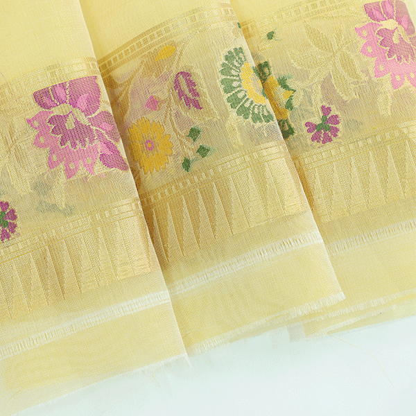 Flat lay view of the premium unstitched organza blouse fabric featuring a coordinating woven border included with the Celestial Charm saree.