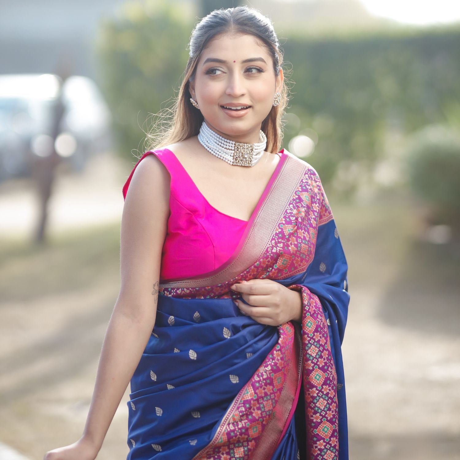 Patola silk saree with intricate woven pattern in blue and pink for festive occasions