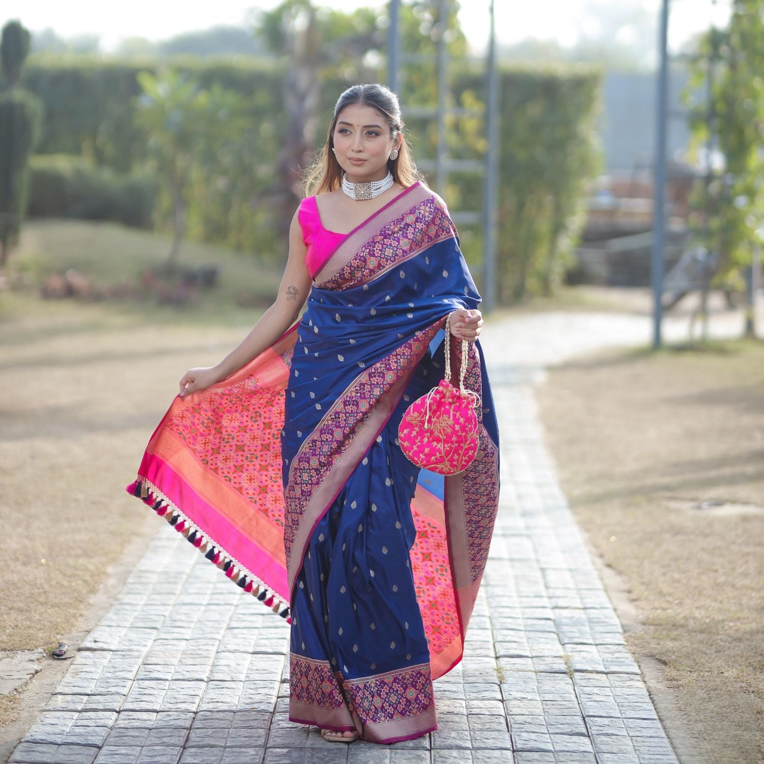 Patola silk saree with intricate woven pattern in blue and pink for festive occasions